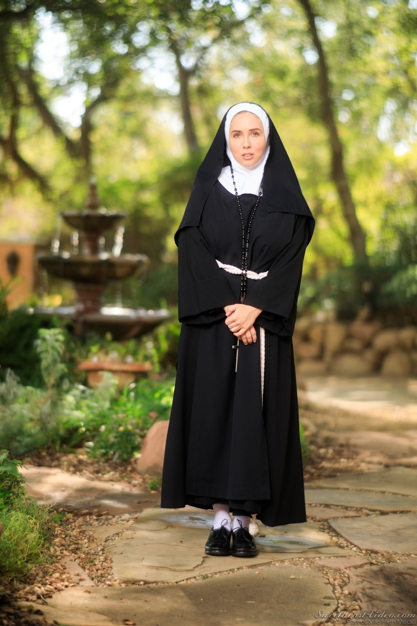 Thick Nun exposes herself in the courtyard wearing over the knee socks