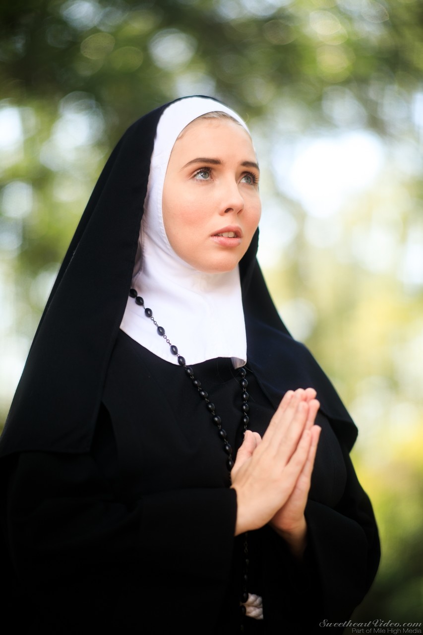 Thick Nun exposes herself in the courtyard wearing over the knee socks