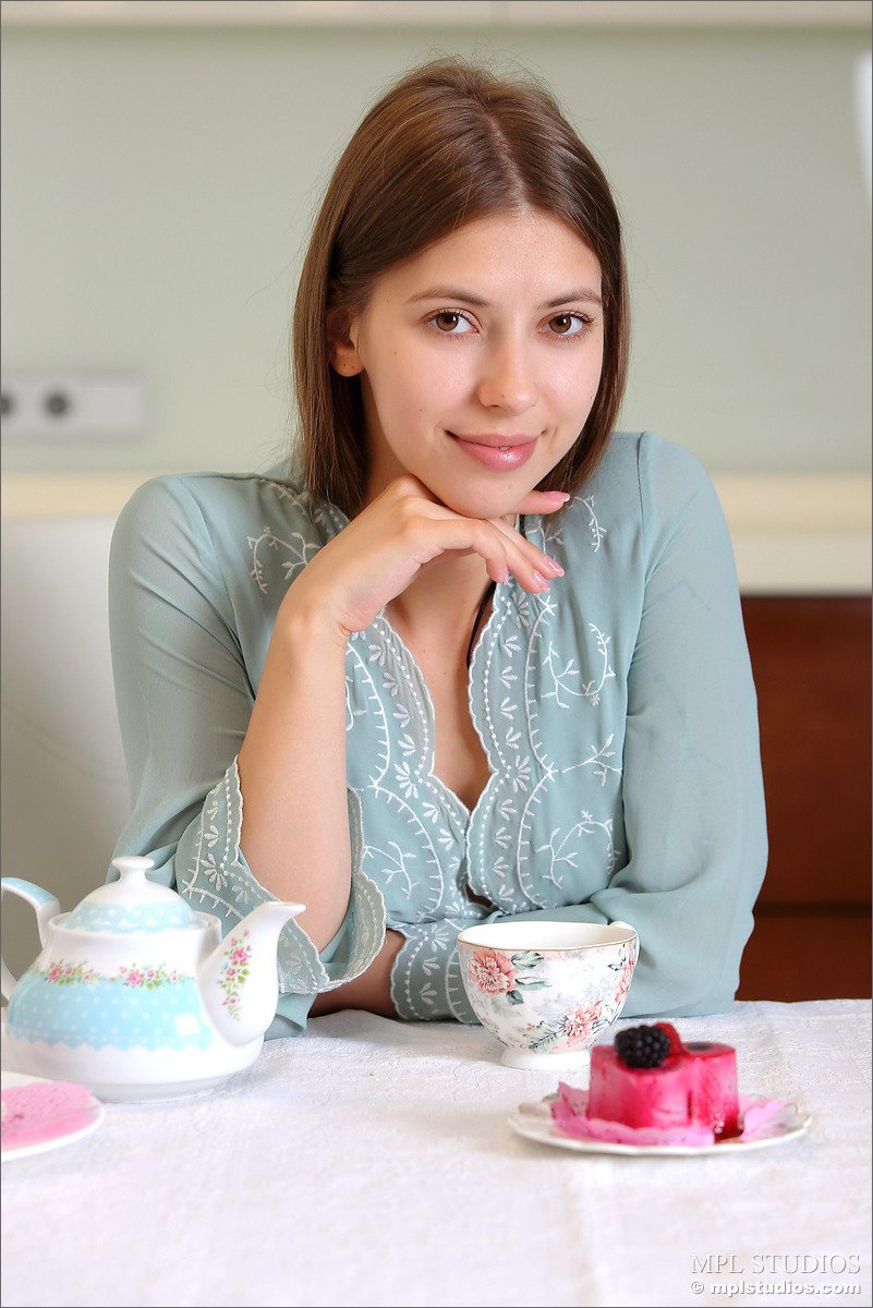 Beautiful girl gets completely naked over a cup of tea in the morning