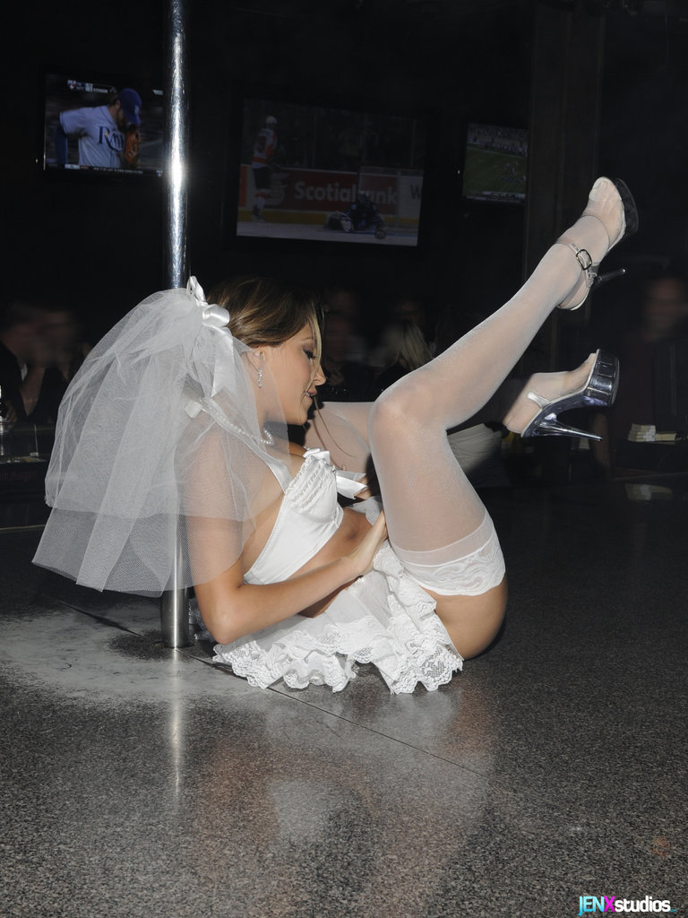 Jenna Haze puts on a show in a strip club while wearing white stockings