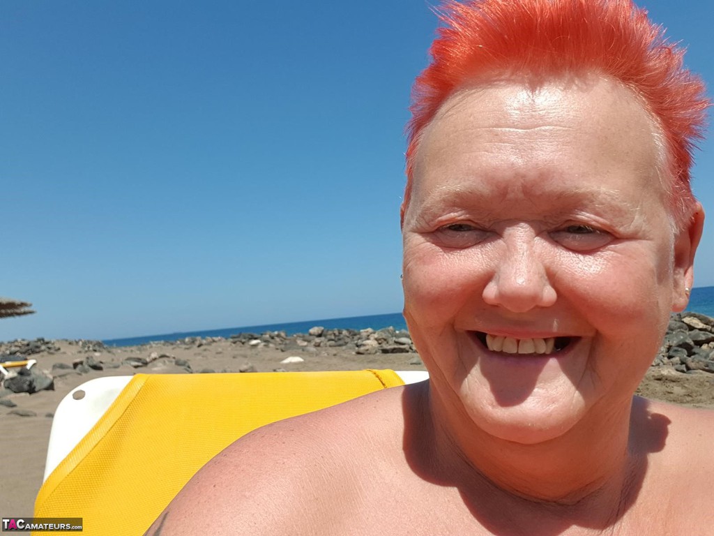 Old SSBBW Val Gasmic dyes her hair red before exposing herself on the beach