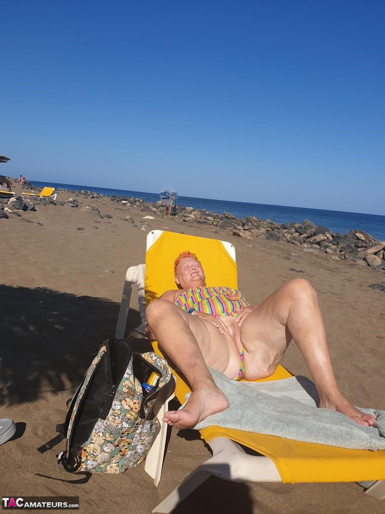 Old SSBBW Val Gasmic dyes her hair red before exposing herself on the beach