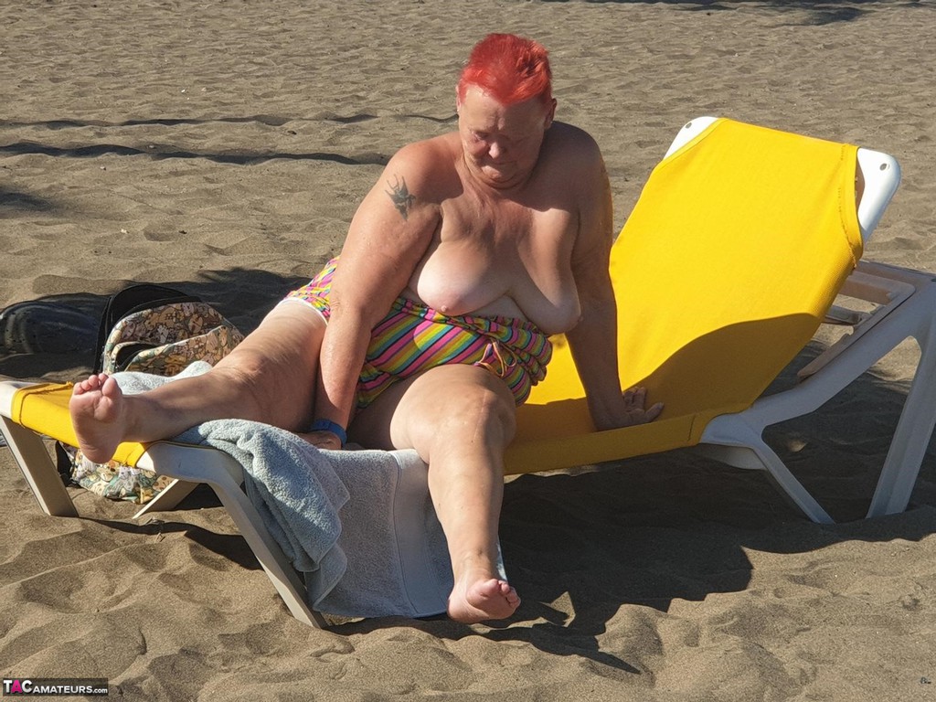 Old SSBBW Val Gasmic dyes her hair red before exposing herself on the beach