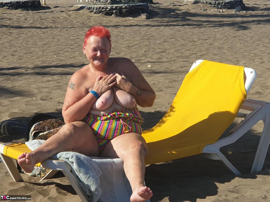 Old SSBBW Val Gasmic dyes her hair red before exposing herself on the beach