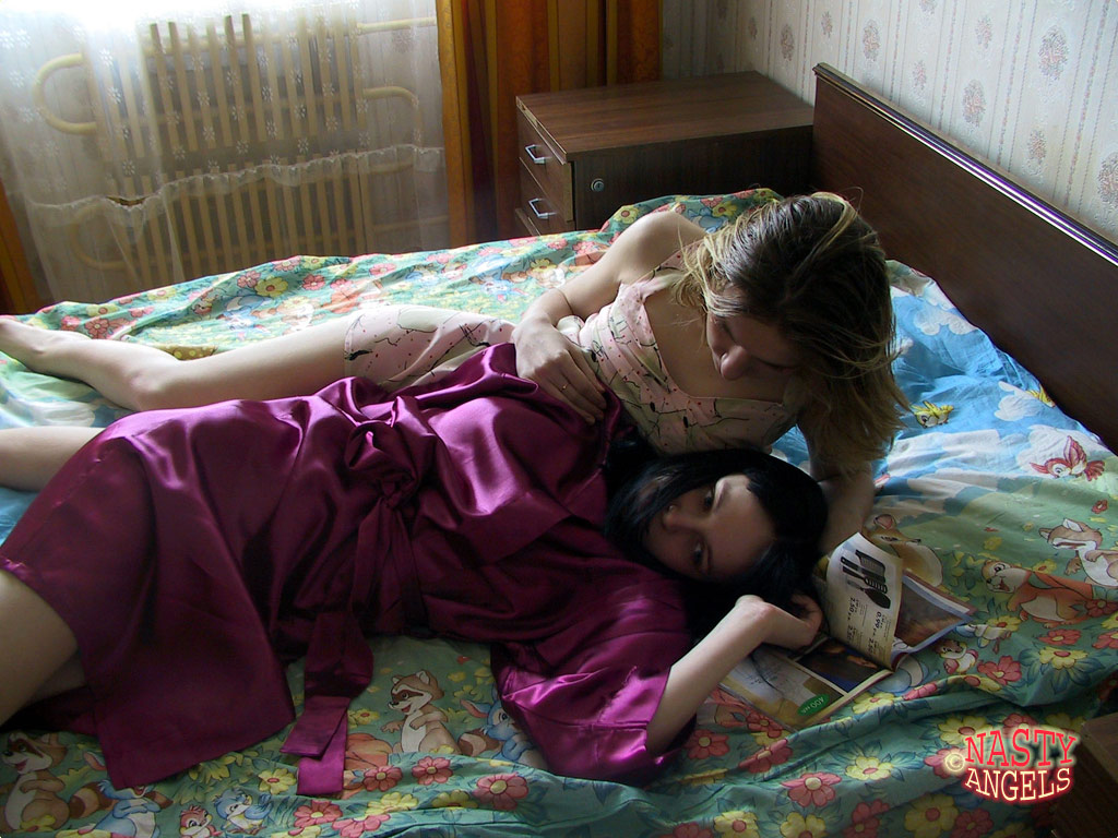 Naughty amateur teens Alina & Marina cuddle in bed after taking a shower