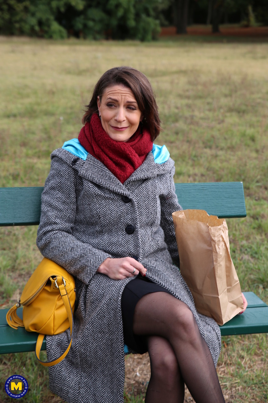 French mom Anya flashes her legs in stockings while eating a sandwich outside