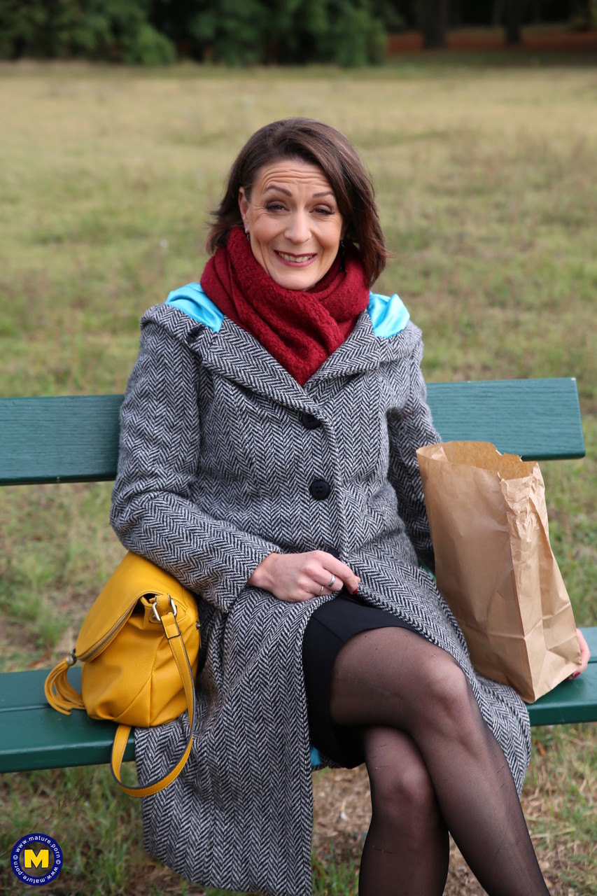 French mom Anya flashes her legs in stockings while eating a sandwich outside