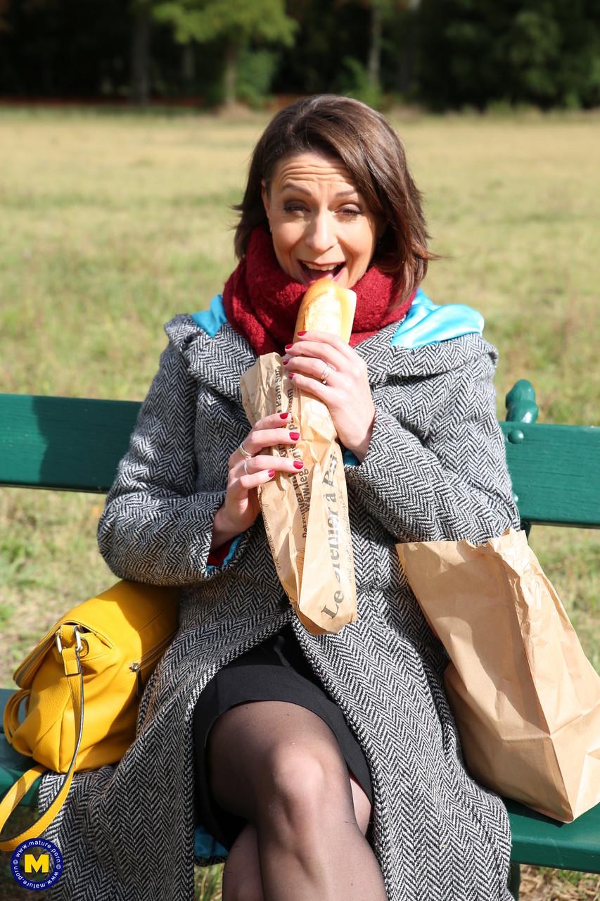 French mom Anya flashes her legs in stockings while eating a sandwich outside