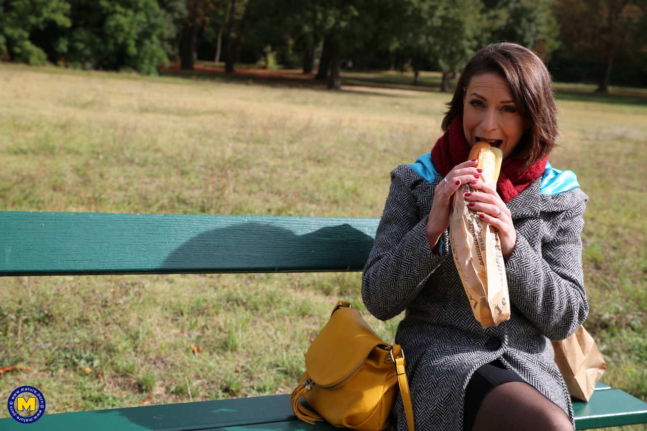 French mom Anya flashes her legs in stockings while eating a sandwich outside