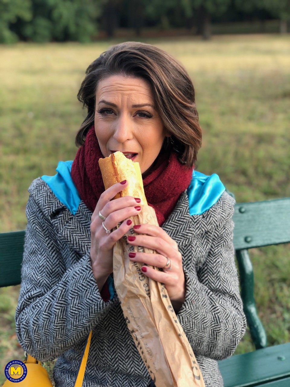 French mom Anya flashes her legs in stockings while eating a sandwich outside