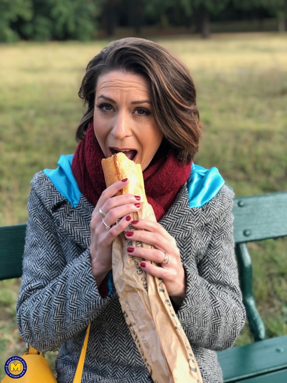 French mom Anya flashes her legs in stockings while eating a sandwich outside