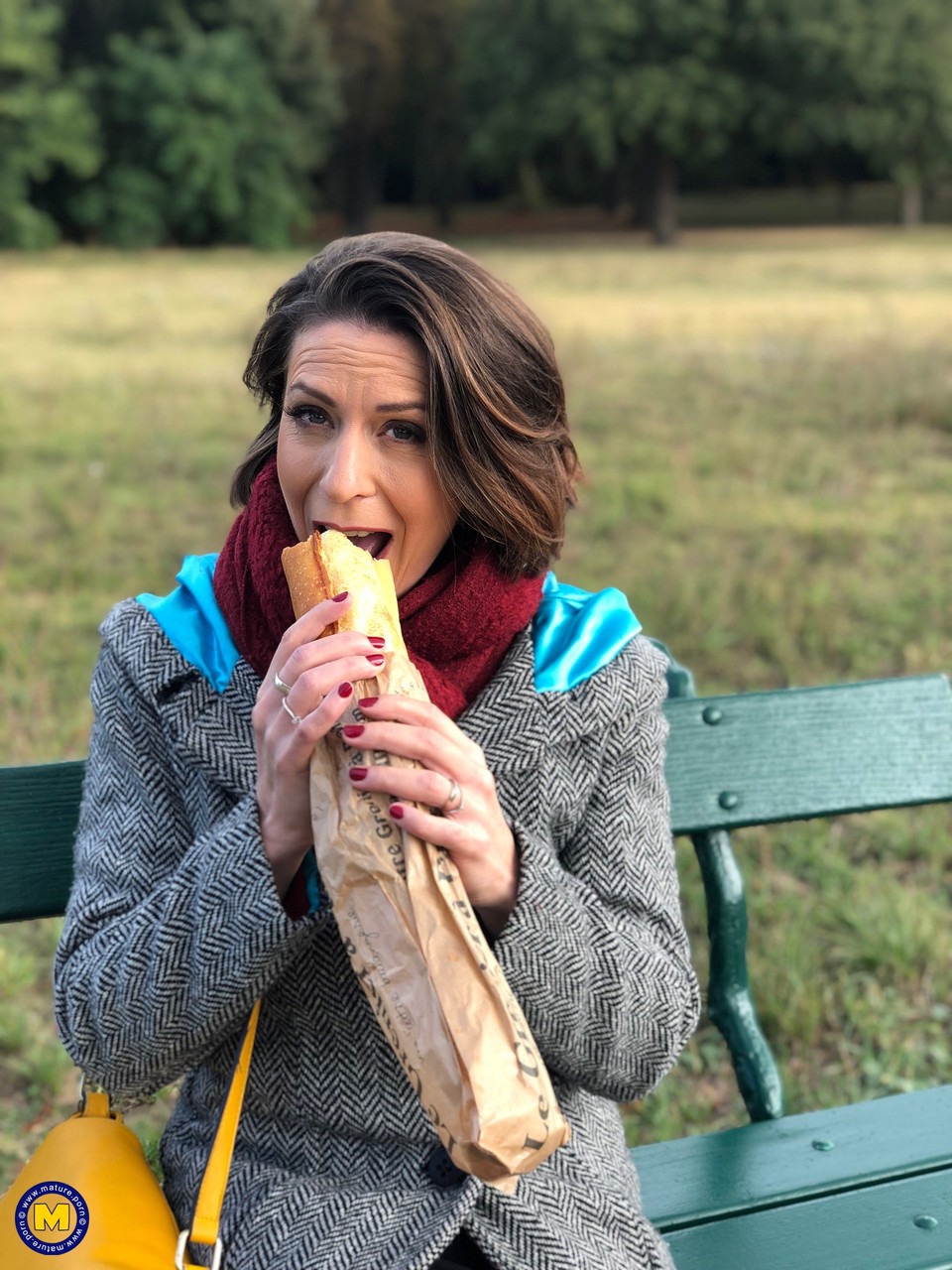 French mom Anya flashes her legs in stockings while eating a sandwich outside