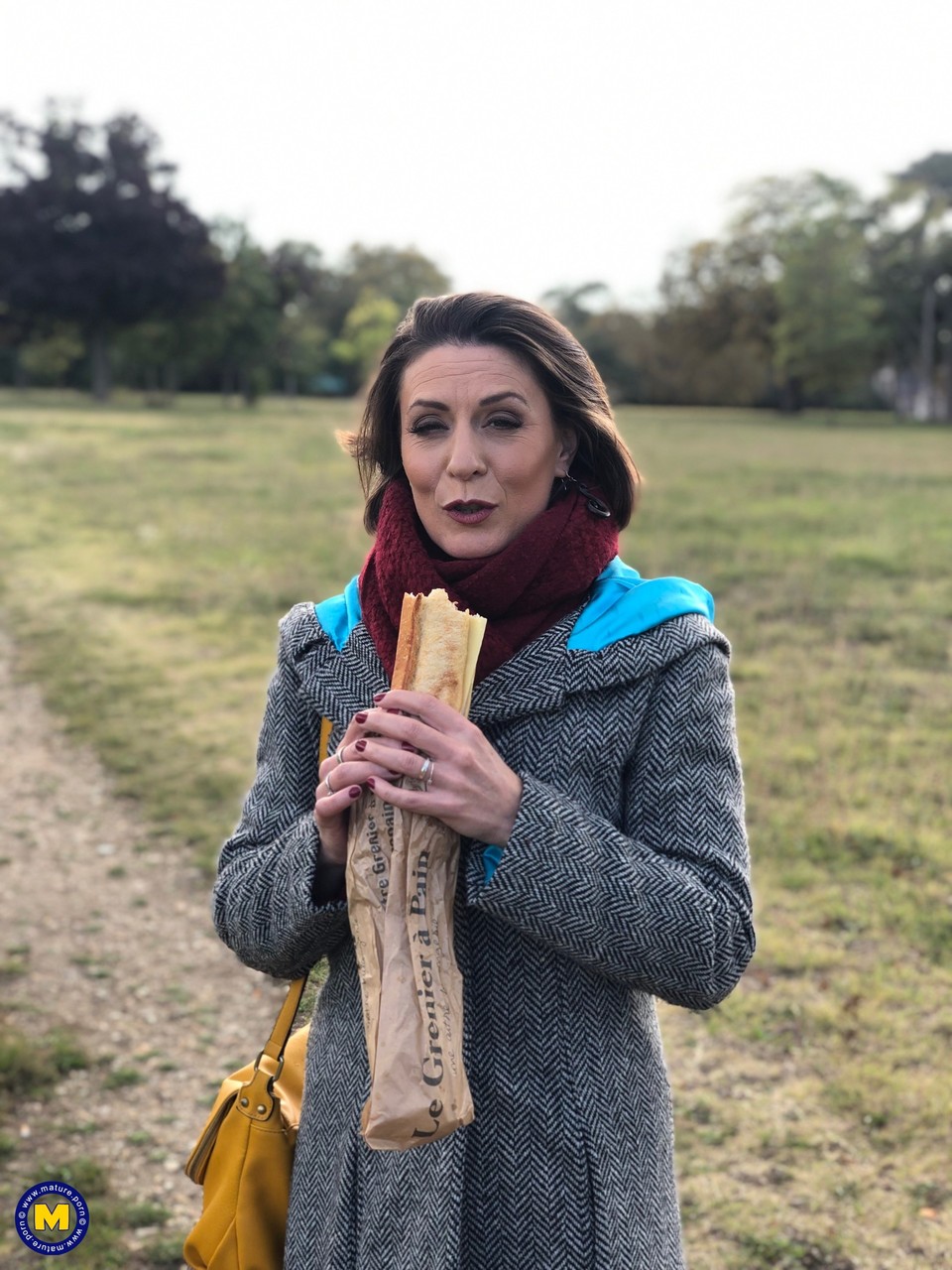 French mom Anya flashes her legs in stockings while eating a sandwich outside