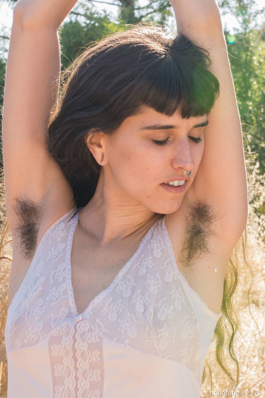 Amateur teen with hairy armpits Bella Mae spreads her bushy pussy outdoors