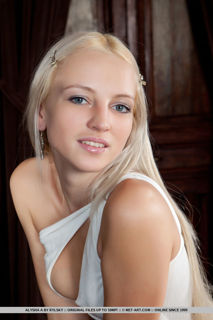 Sensual blonde teen Alysha removes her dress to show off her muff