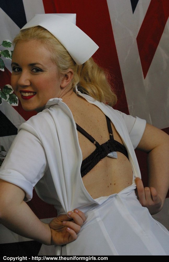 Blonde British nurse exposes her tits and snatch in tan nylons