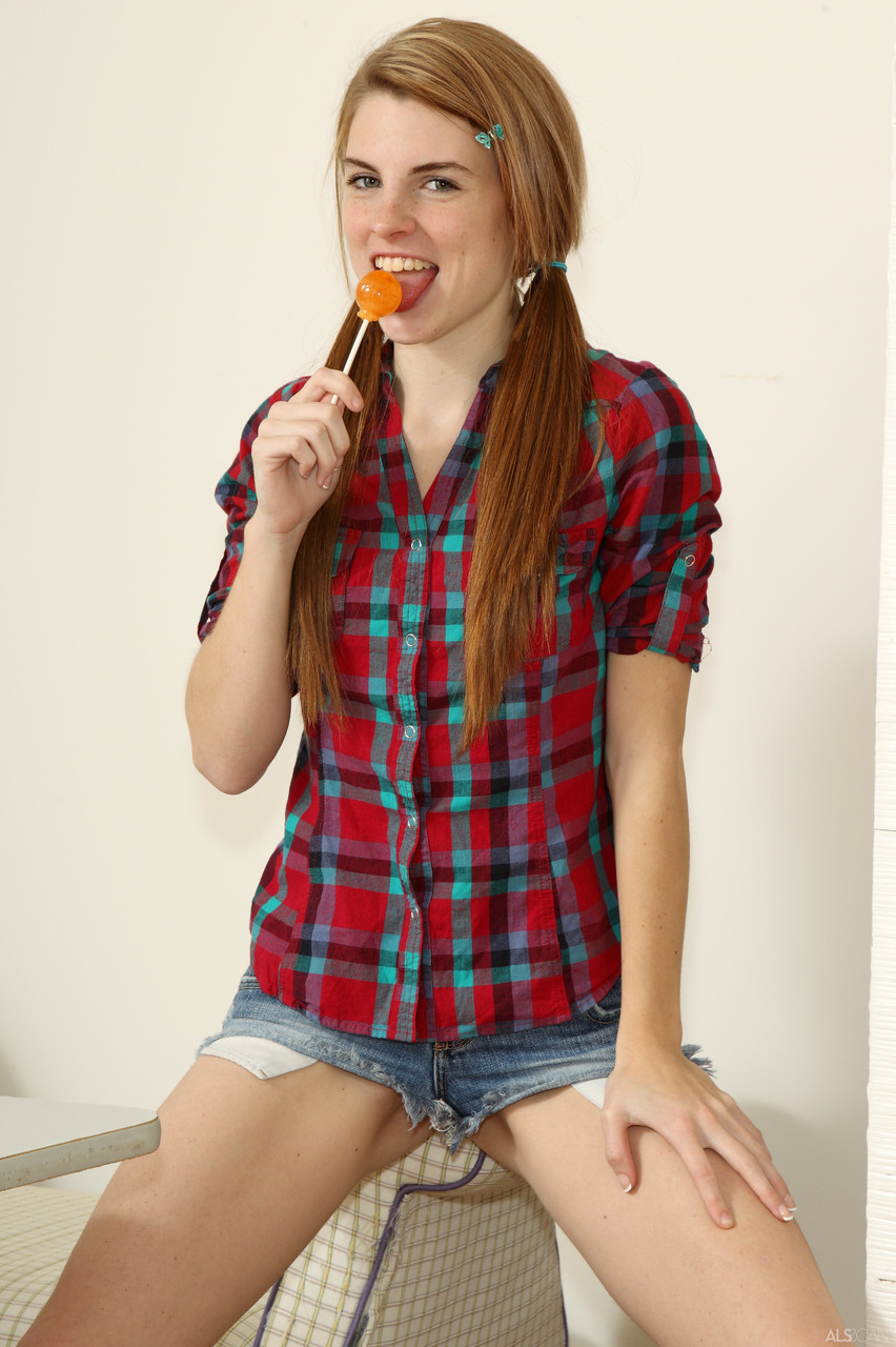 Kinky teen in a plaid shirt Aubrey Belle masturbates with an orange lollipop