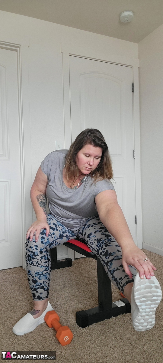 Obese amateur Busty Kris Ann gets naked while working out at home