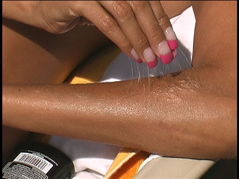 Beautiful tanned Lori Anderson teases with her hairy arms while sunbathing