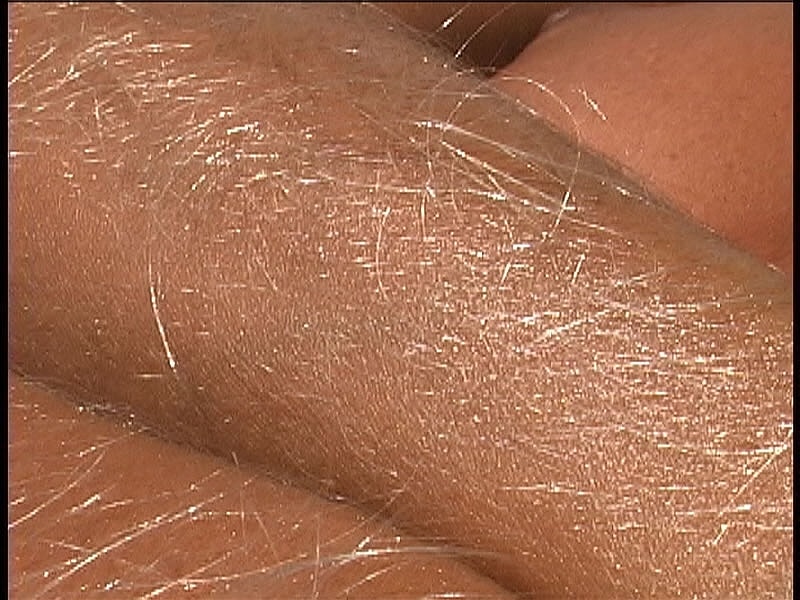 Beautiful tanned Lori Anderson teases with her hairy arms while sunbathing