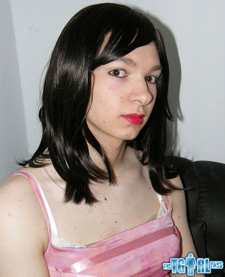 Petite TGirl showing off that slender body of hers in a pink dress