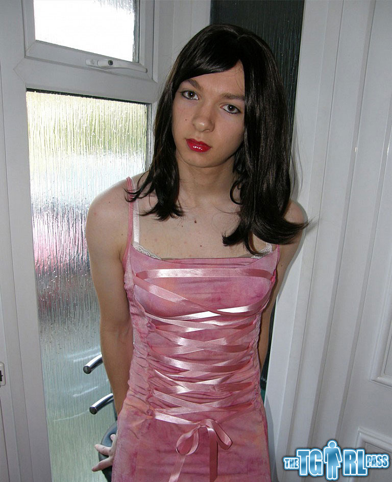 Petite TGirl showing off that slender body of hers in a pink dress