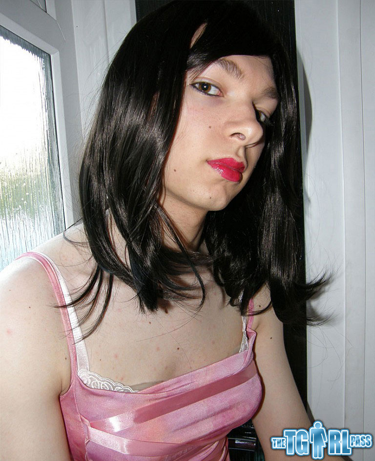 Petite TGirl showing off that slender body of hers in a pink dress