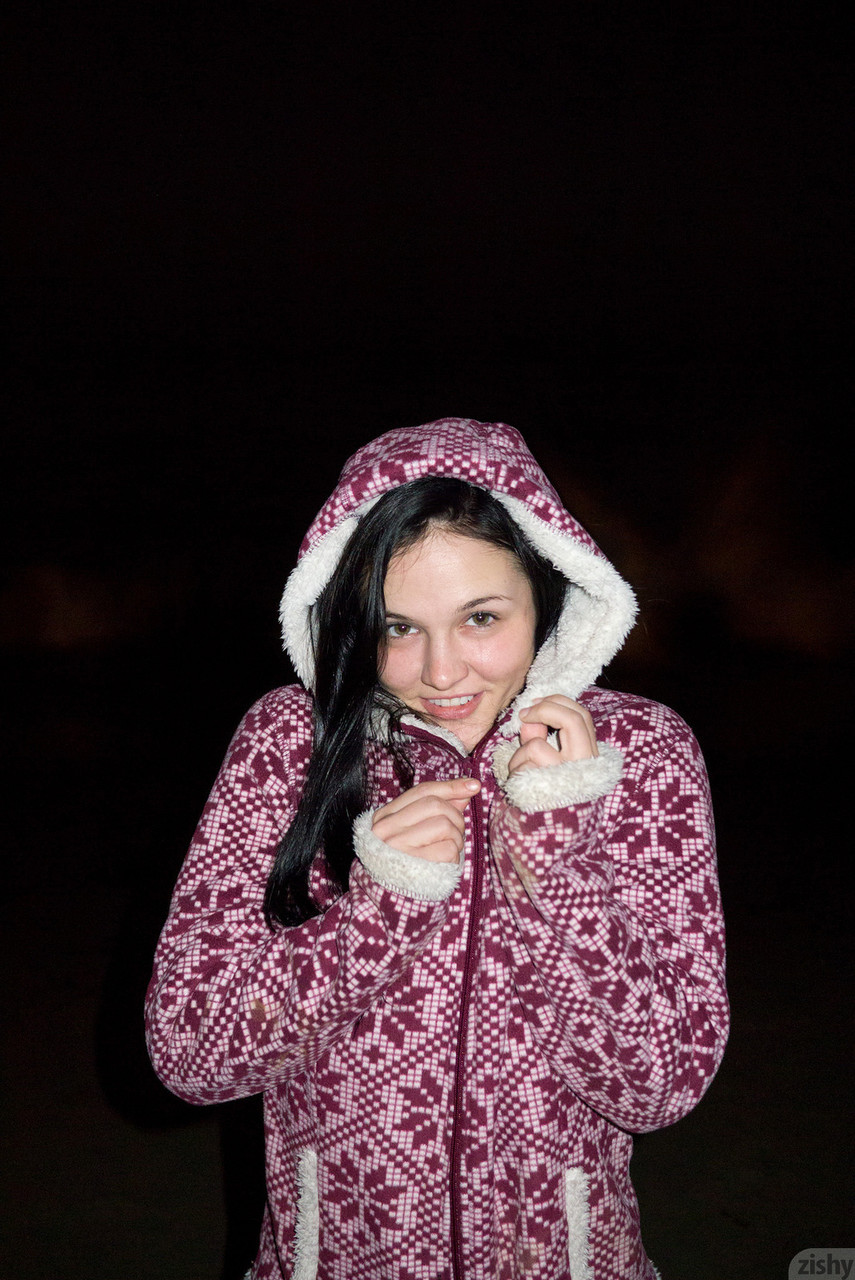 Adorable girl Logan Drae shows her flexibility while she's naked on the beach