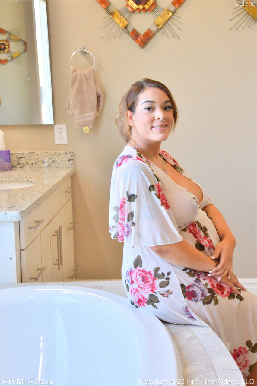 Pregnant MILF Valerie shows her swollen tits & toys herself in the bathtub