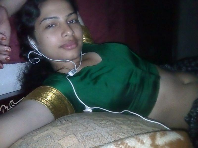 Indian wife listens to music while setting her natural tits free