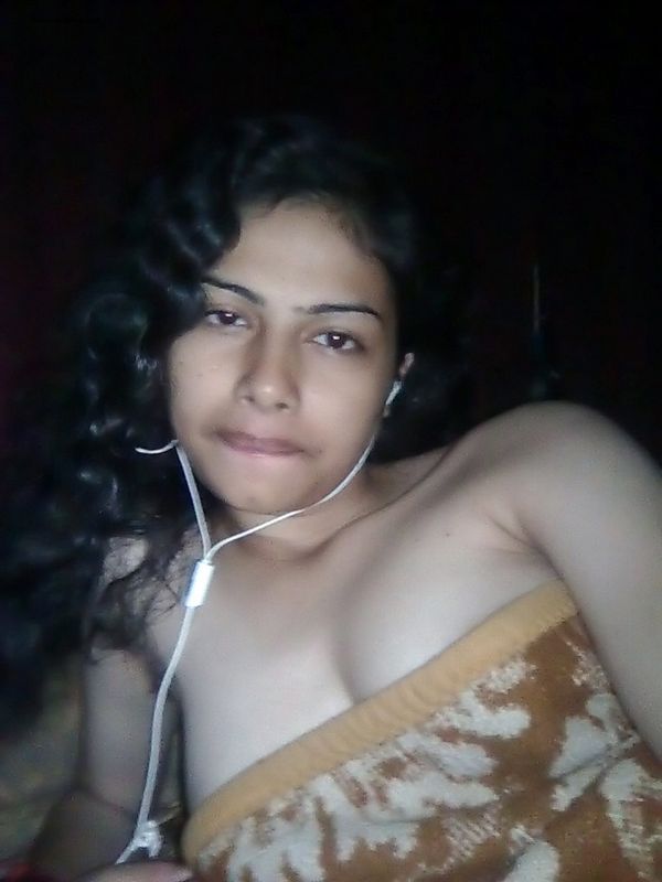 Indian wife listens to music while setting her natural tits free